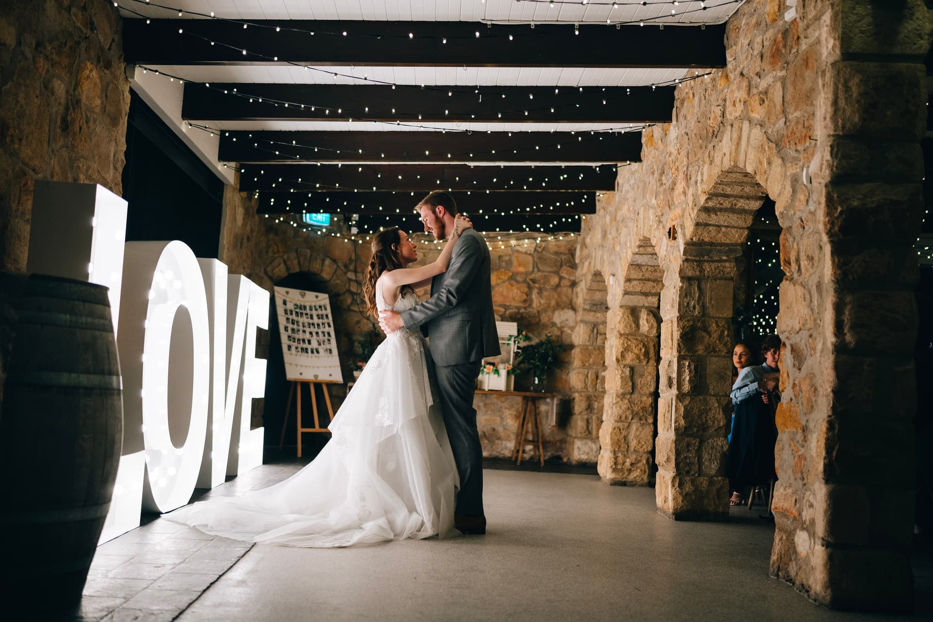 First dance under fairy lights with LOVE letters